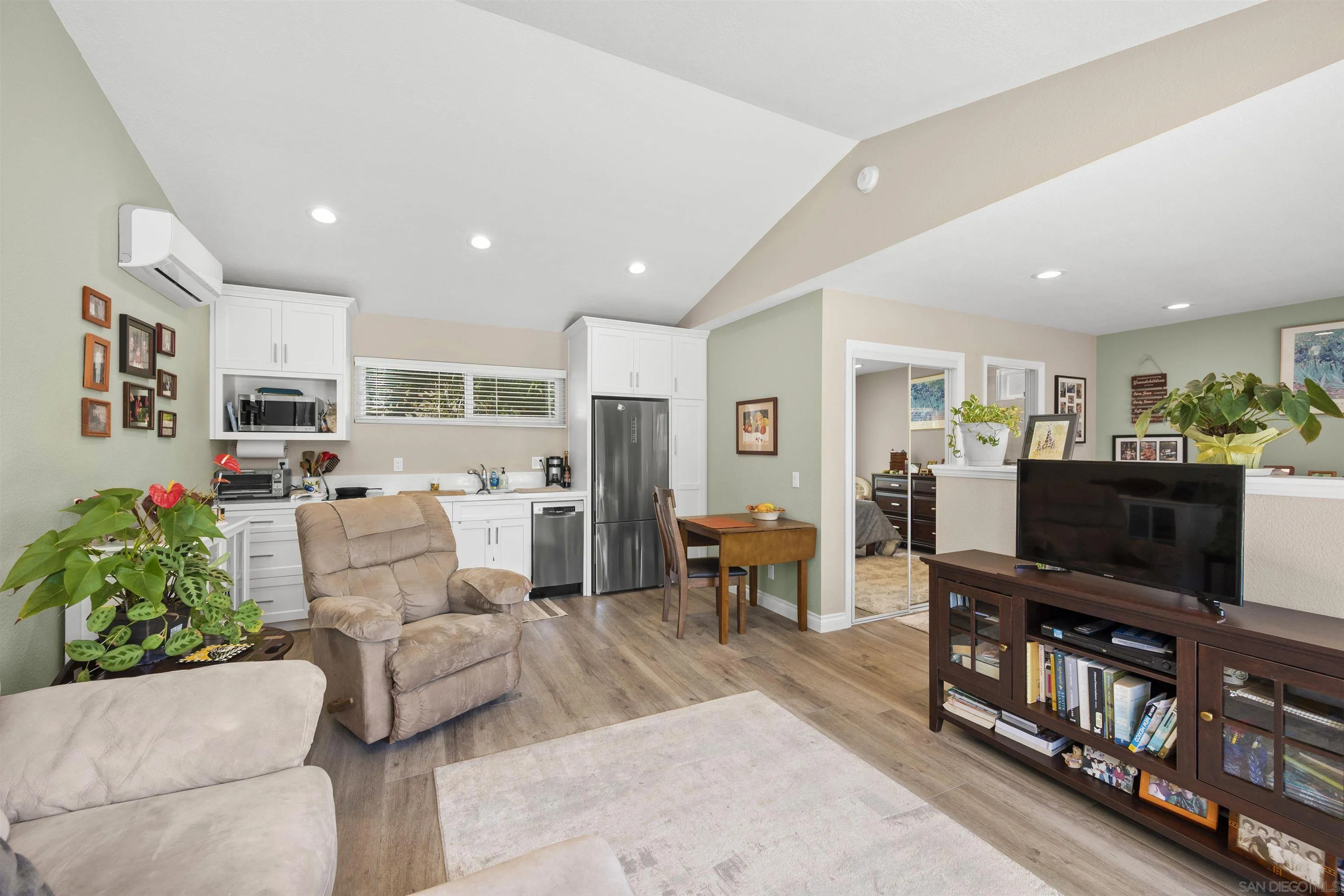 1510 Orangeview Drive, Unit 12 Encinitas, CA 92024 - Photo 45 of 55 a living room with furniture and a flat screen tv
