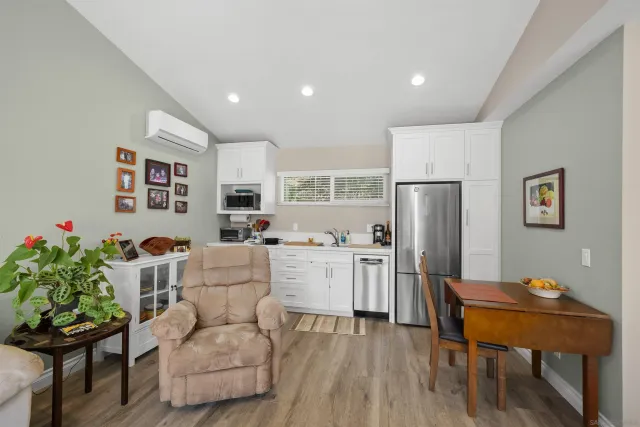 a utility room with sink dryer and washer