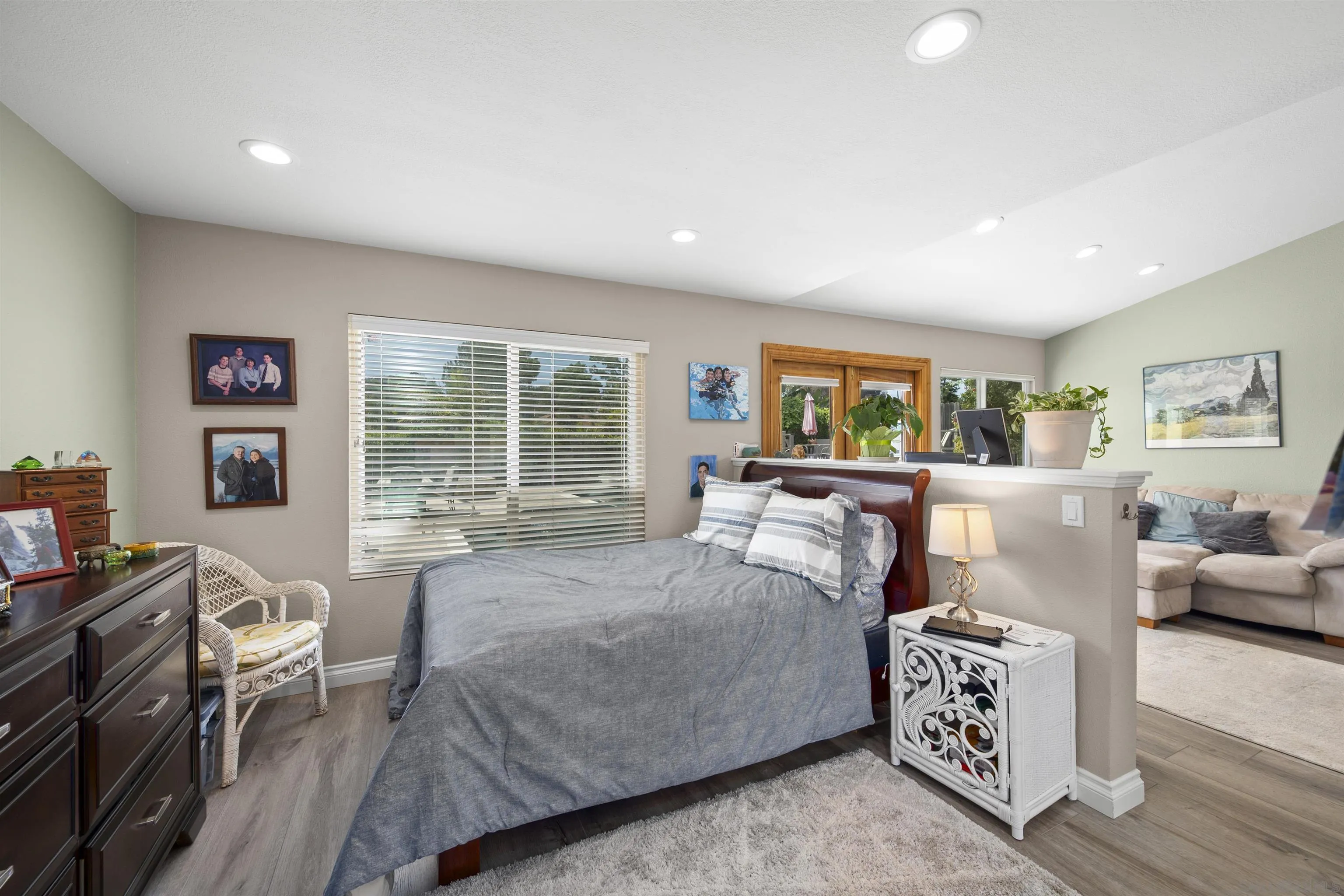 1510 Orangeview Drive, Unit 12 Encinitas, CA 92024 - Photo 47 of 55 a bedroom with furniture and a large window