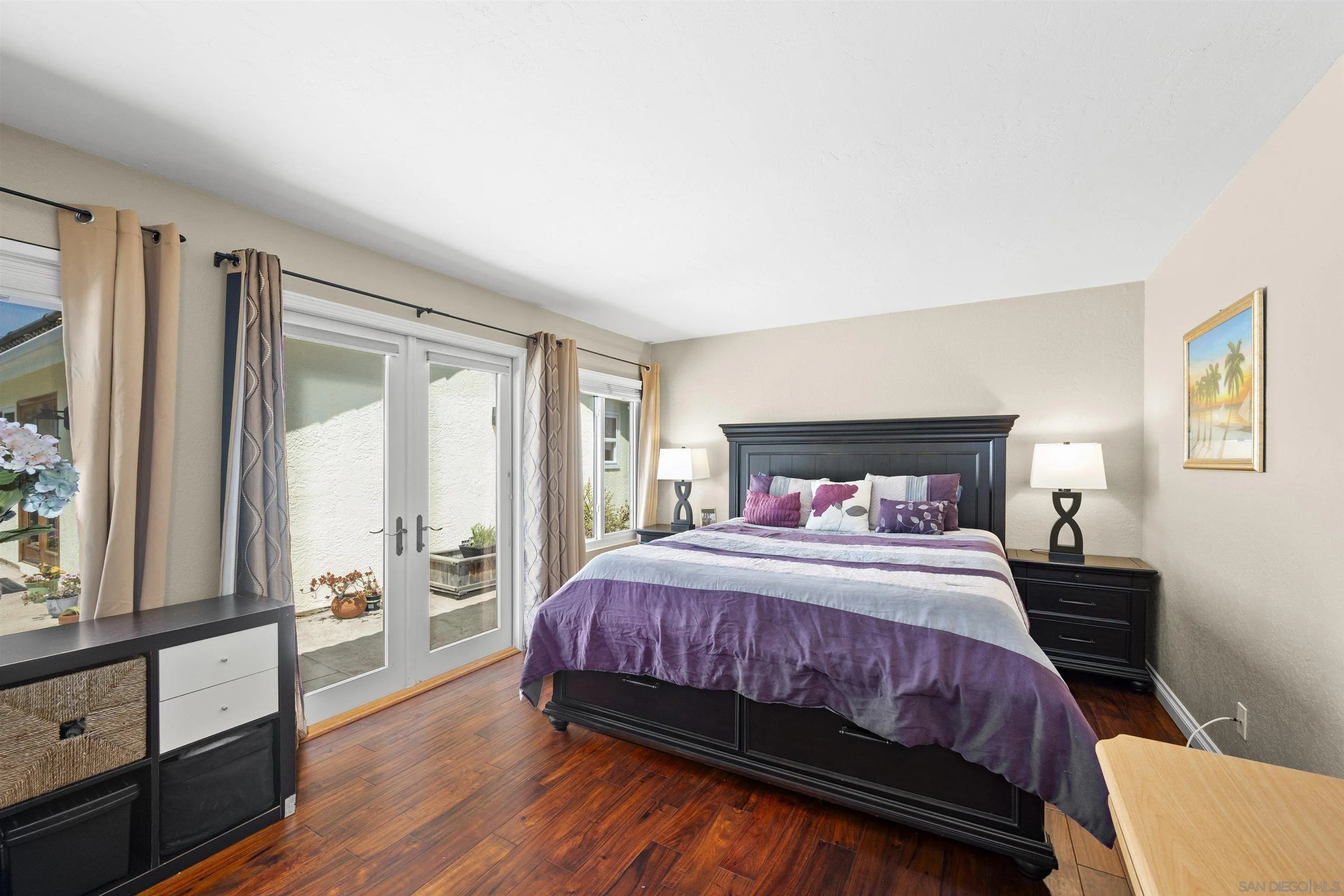 1510 Orangeview Drive, Unit 12 Encinitas, CA 92024 - Photo 5 of 19 a bedroom with a bed and a large window