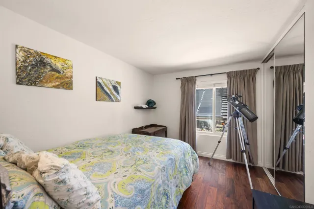 a bedroom with a bed and a walk in closet