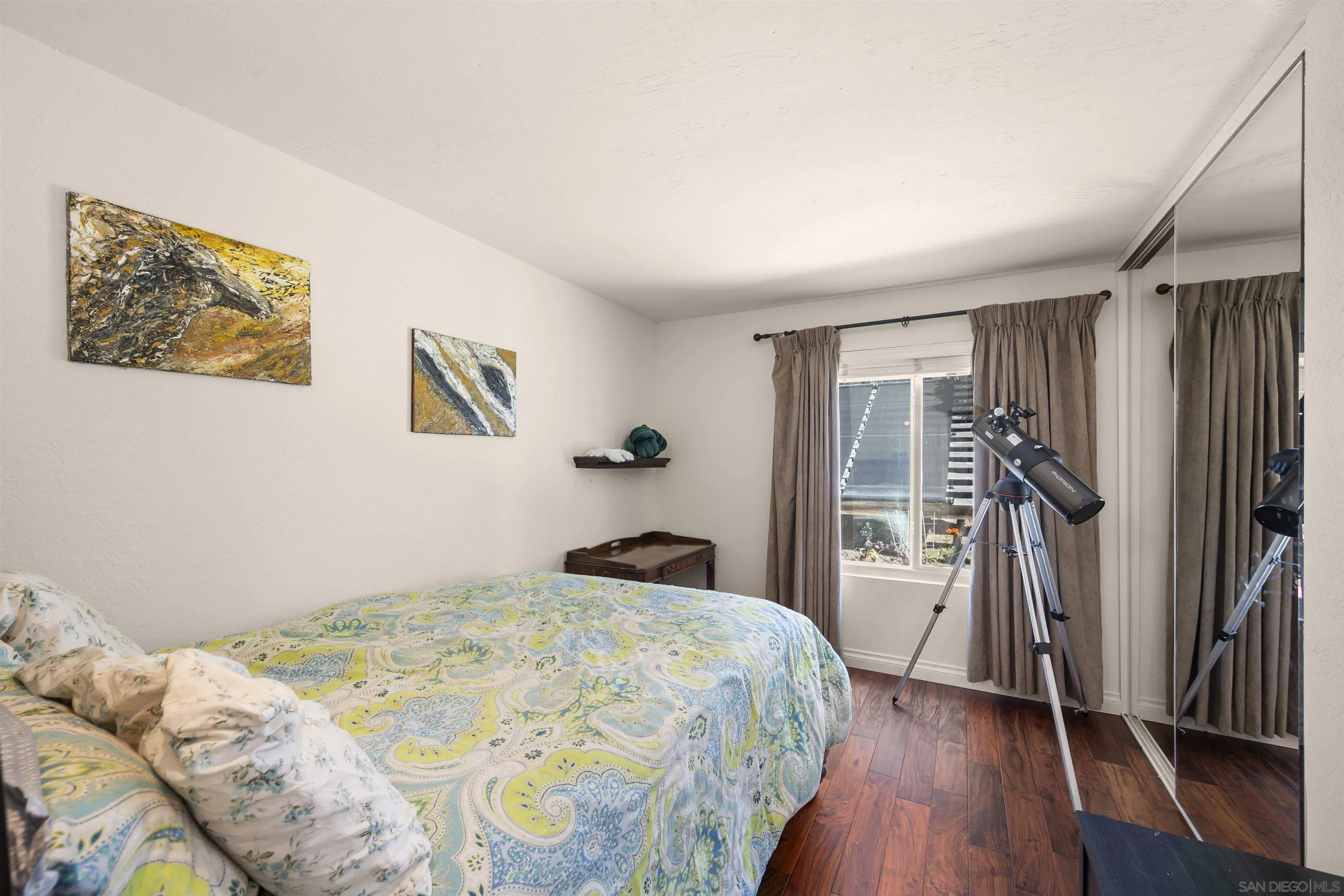 1510 Orangeview Drive, Unit 12 Encinitas, CA 92024 - Photo 8 of 19 a bedroom with a bed and a walk in closet