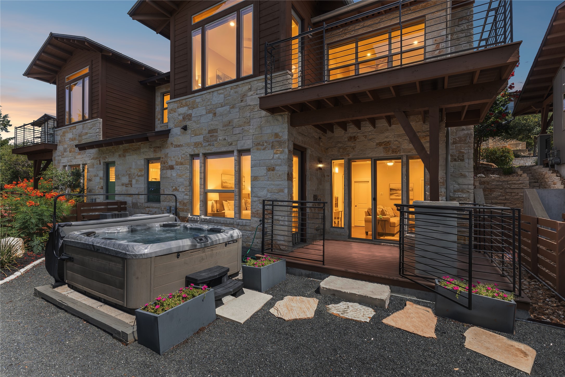 8110 Ranch Road 2222, Unit 68 Austin, TX 78730 - Photo 22 of 24 An inviting private spa with a hot tub and an elevated deck provides a tranquil outdoor retreat.