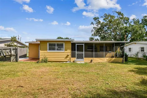 an aerial view of a house with a garden