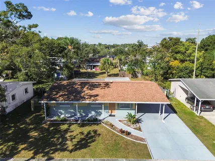 a aerial view of a house with a yard