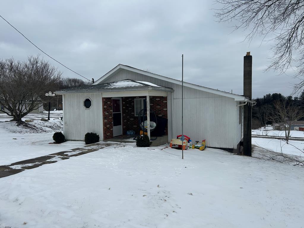 734 Main Street Rimersburg, PA 16248 - Photo 1 of 15 a view of a house with a patio