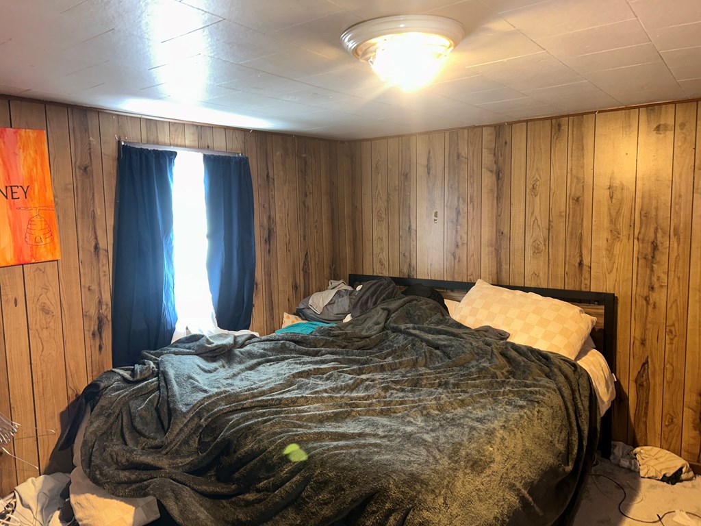 734 Main Street Rimersburg, PA 16248 - Photo 8 of 15 a bed sitting in a bedroom next to a window and a closet