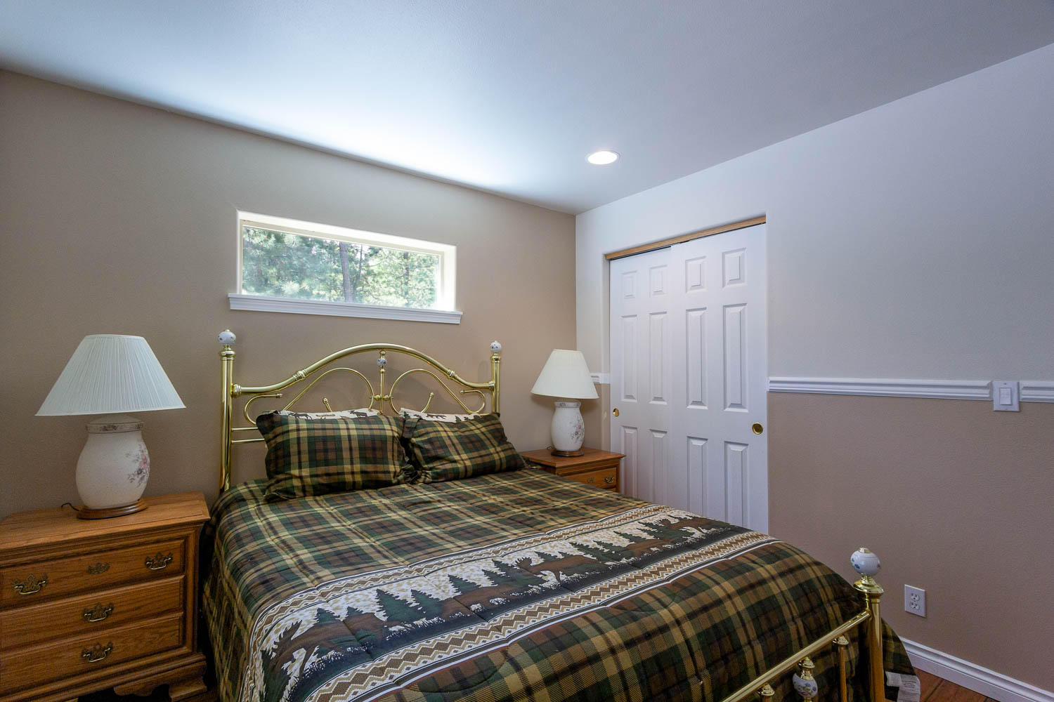 17151 Merced Road Bend, OR 97707 - Photo 21 of 30 a bedroom with a bed and a lamp