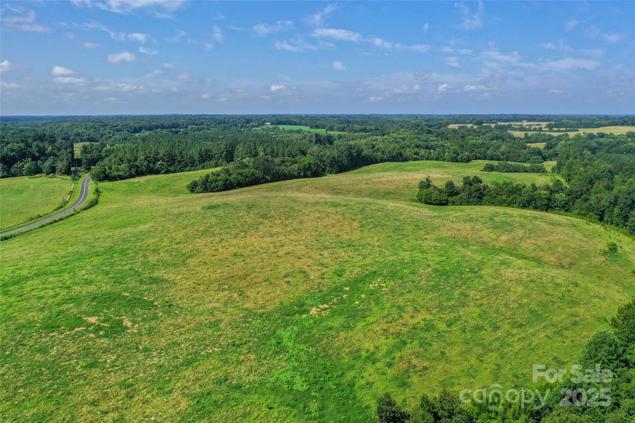 0 Lucy Short Cut Road, Unit D Marshville, NC 28103 - Photo 7 of 23 a view of a garden with a building in the background