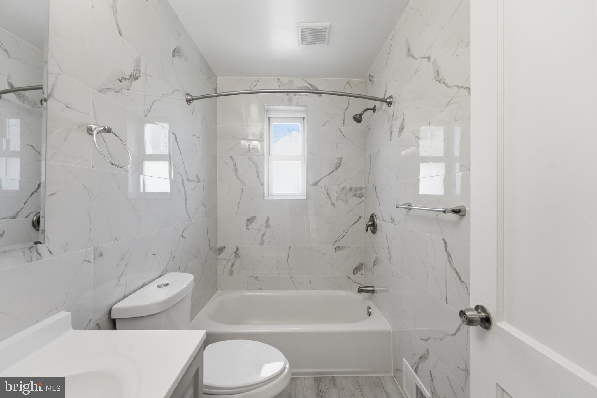 10303 Haywood Dr. Silver Spring, MD 20902 - Photo 23 of 38 Elegant marble-clad bathroom retreat.