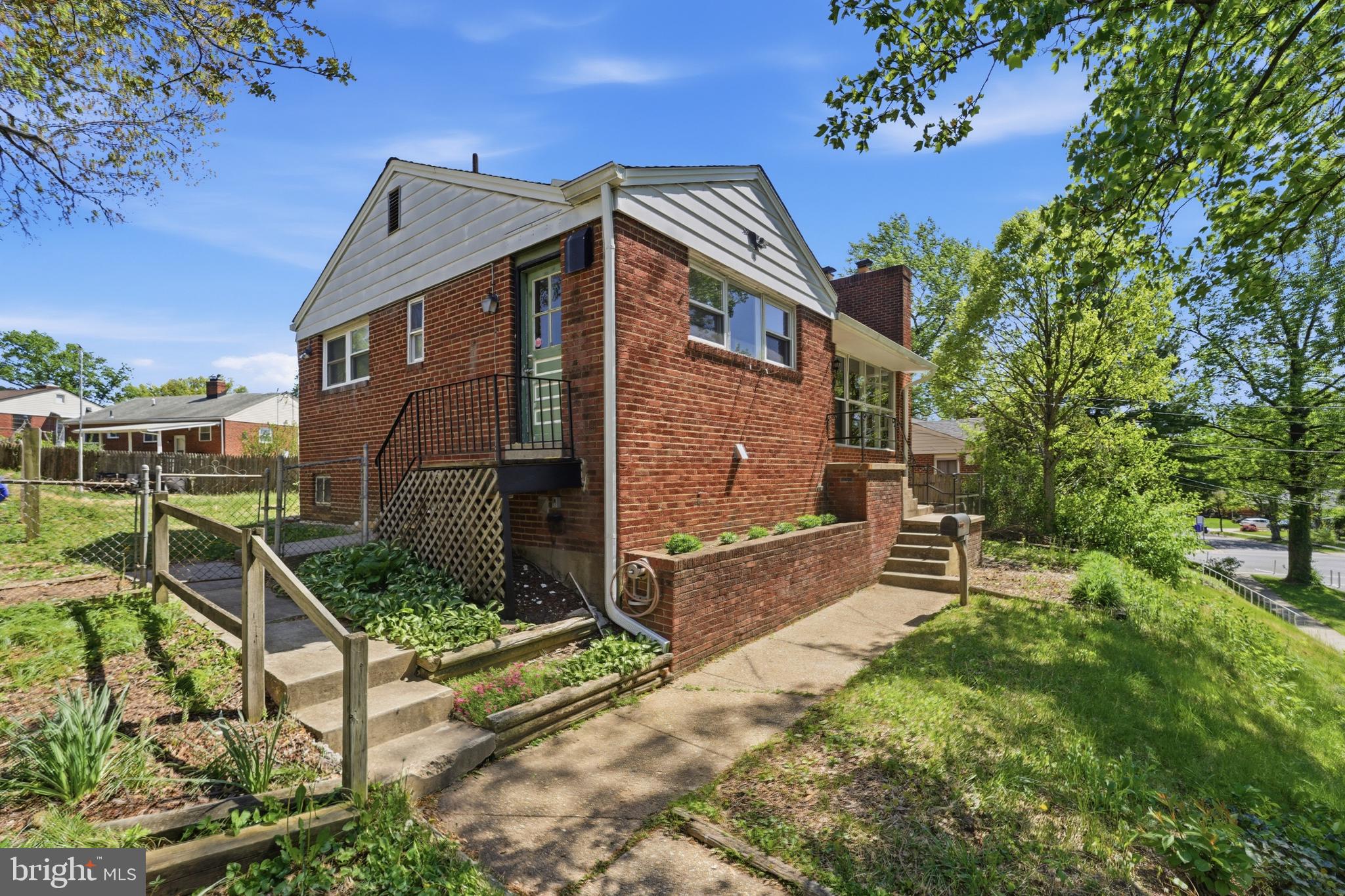 10303 Haywood Dr. Silver Spring, MD 20902 - Photo 3 of 38 Charming brick home with lush greenery.