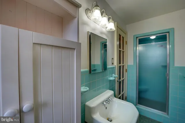 a view of walk in closet with clothes