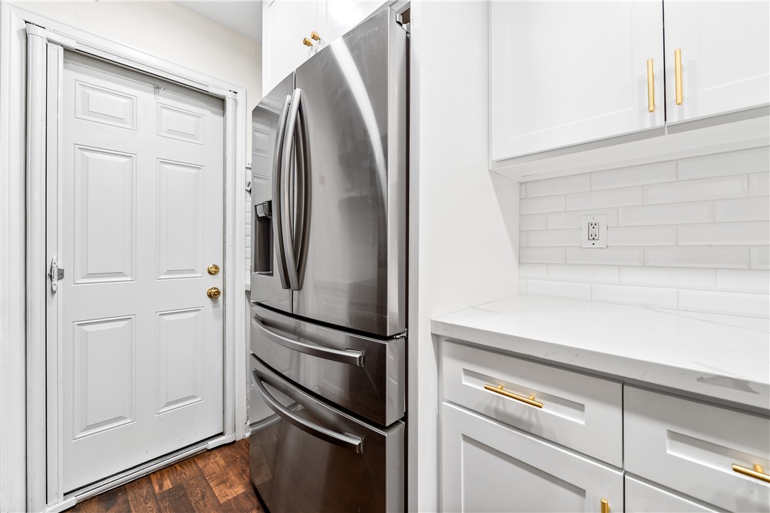 7890 East Spring Street Long Beach, CA 90815 - Photo 19 of 59 a close view of a refrigerator in kitchen and stainless steel appliances