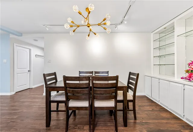 a close view of stove and refrigerator in kitchen