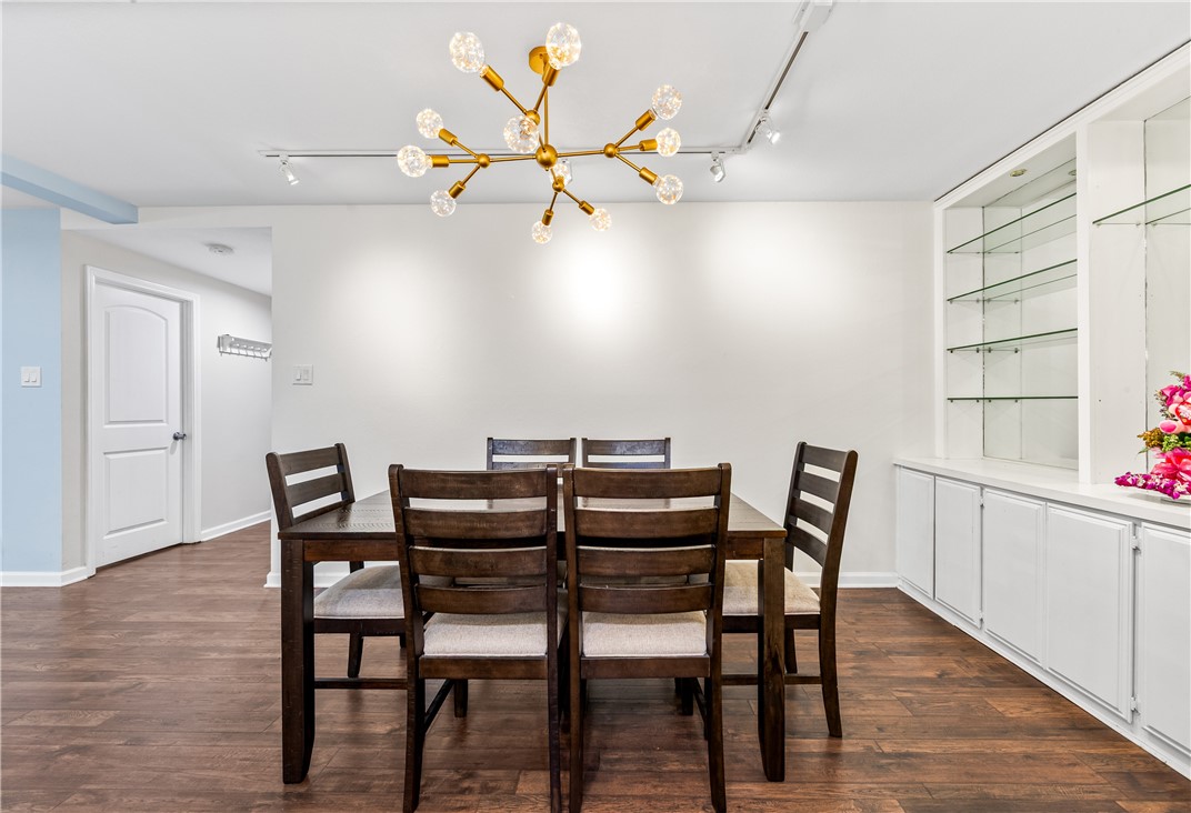 7890 East Spring Street Long Beach, CA 90815 - Photo 21 of 59 a view of a dining room with furniture and wooden floor