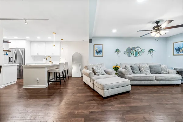 a living room with furniture and a large window