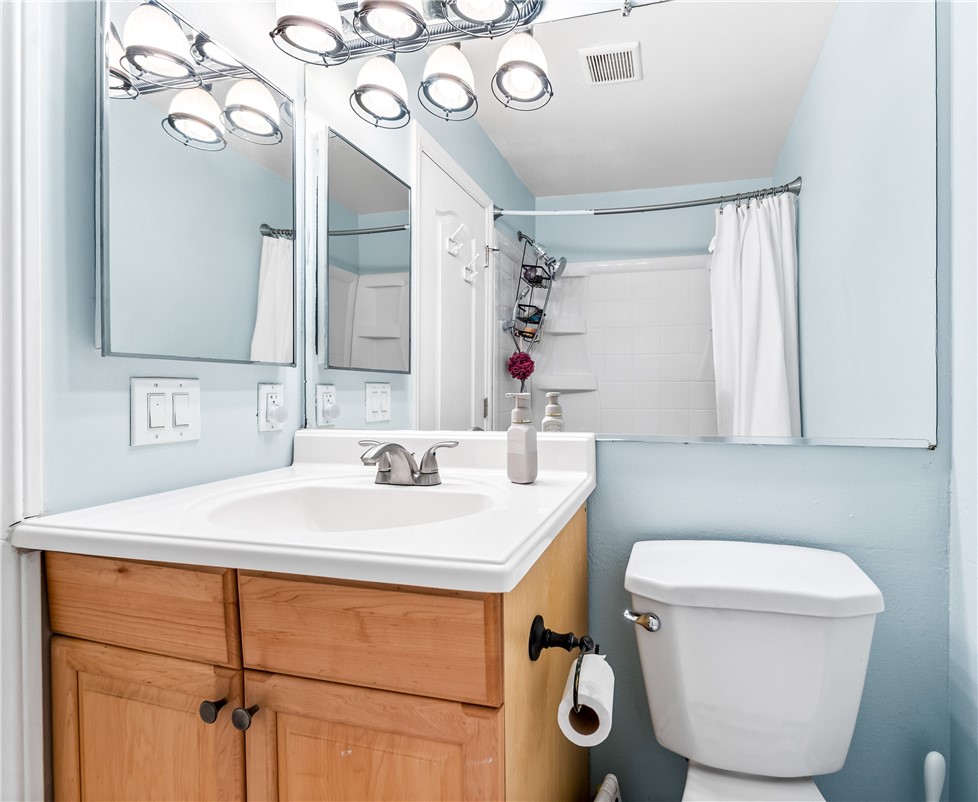 7890 East Spring Street Long Beach, CA 90815 - Photo 51 of 59 a bathroom with a sink a toilet and mirror