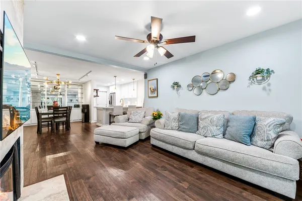 a living room with furniture and a fireplace