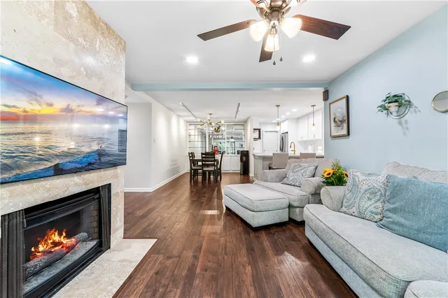 a living room with furniture a fireplace and a fireplace