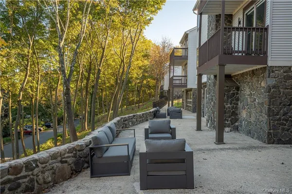 a balcony with wooden floor and fence