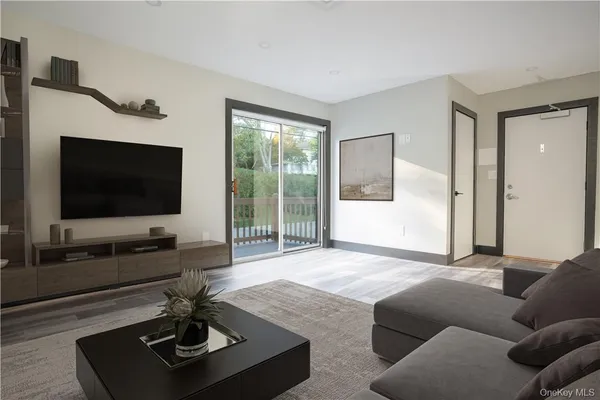 a living room with furniture and a large window