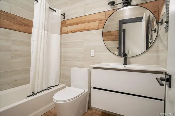a bathroom with a bathtub and sink