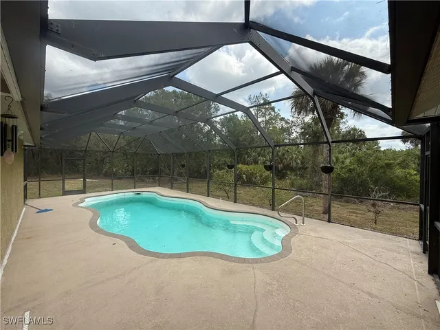 a swimming pool with a yard