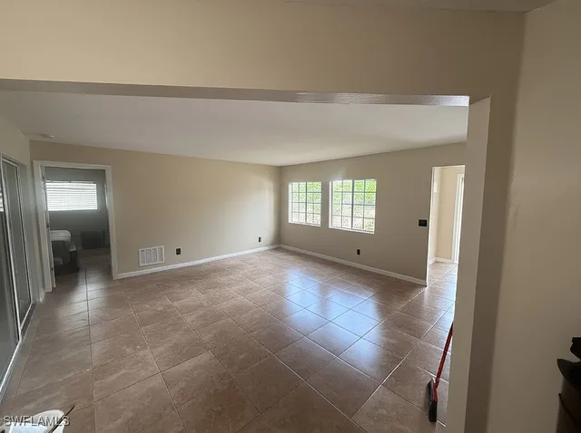 a view of a livingroom and window