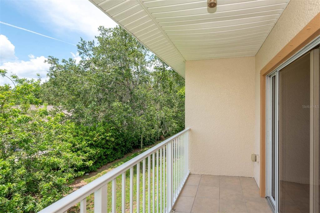 946 15th Street, Unit 202 Daytona Beach, FL 32117 - Photo 11 of 40 a view of a balcony with an outdoor space