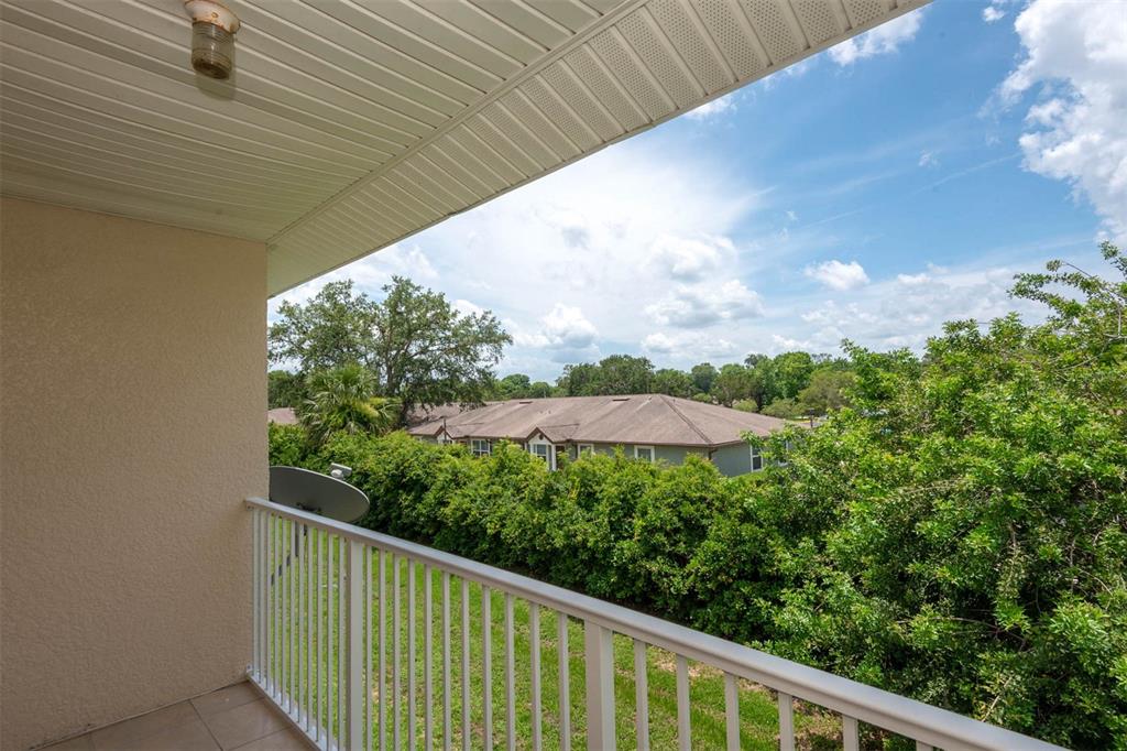 946 15th Street, Unit 202 Daytona Beach, FL 32117 - Photo 13 of 40 a balcony with an outdoor space