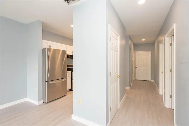 a view of a refrigerator in a kitchen