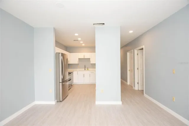 a view of a living room with a refrigerator