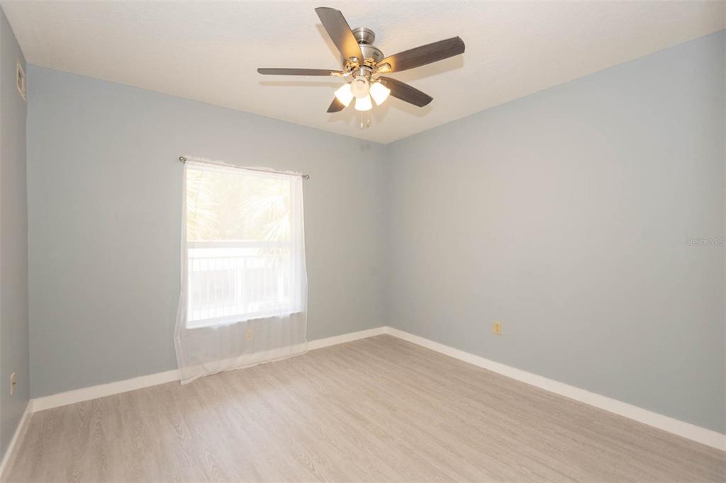 946 15th Street, Unit 202 Daytona Beach, FL 32117 - Photo 27 of 40 an empty room with a window and a fan