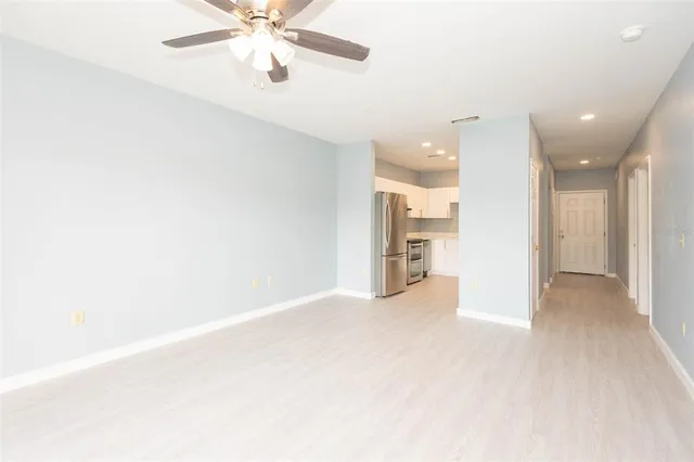a view of an empty room with a cabinet