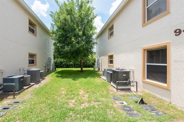 a view of a backyard with furniture