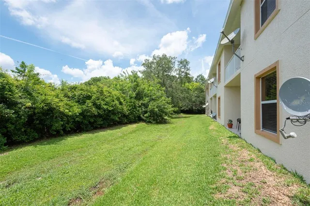 a backyard of a house with lots of green space