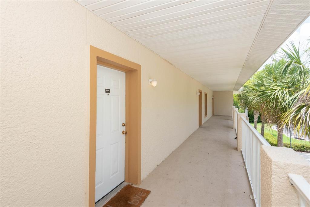 946 15th Street, Unit 202 Daytona Beach, FL 32117 - Photo 8 of 40 a view of a hallway with entryway