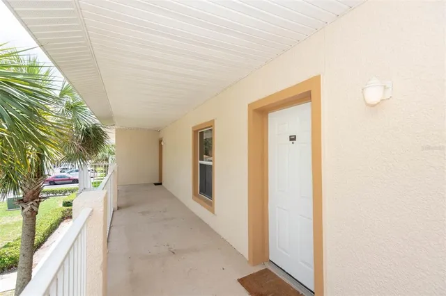 a view of a hallway with wooden walls