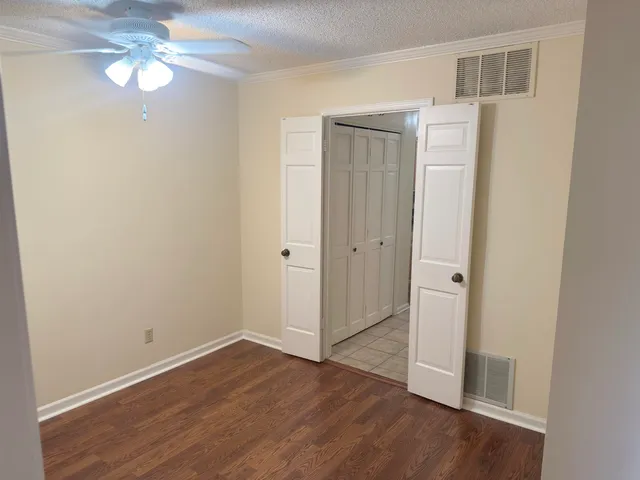 a bathroom with a toilet a sink and a mirror