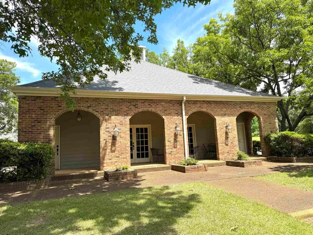 a view of a house with swimming pool