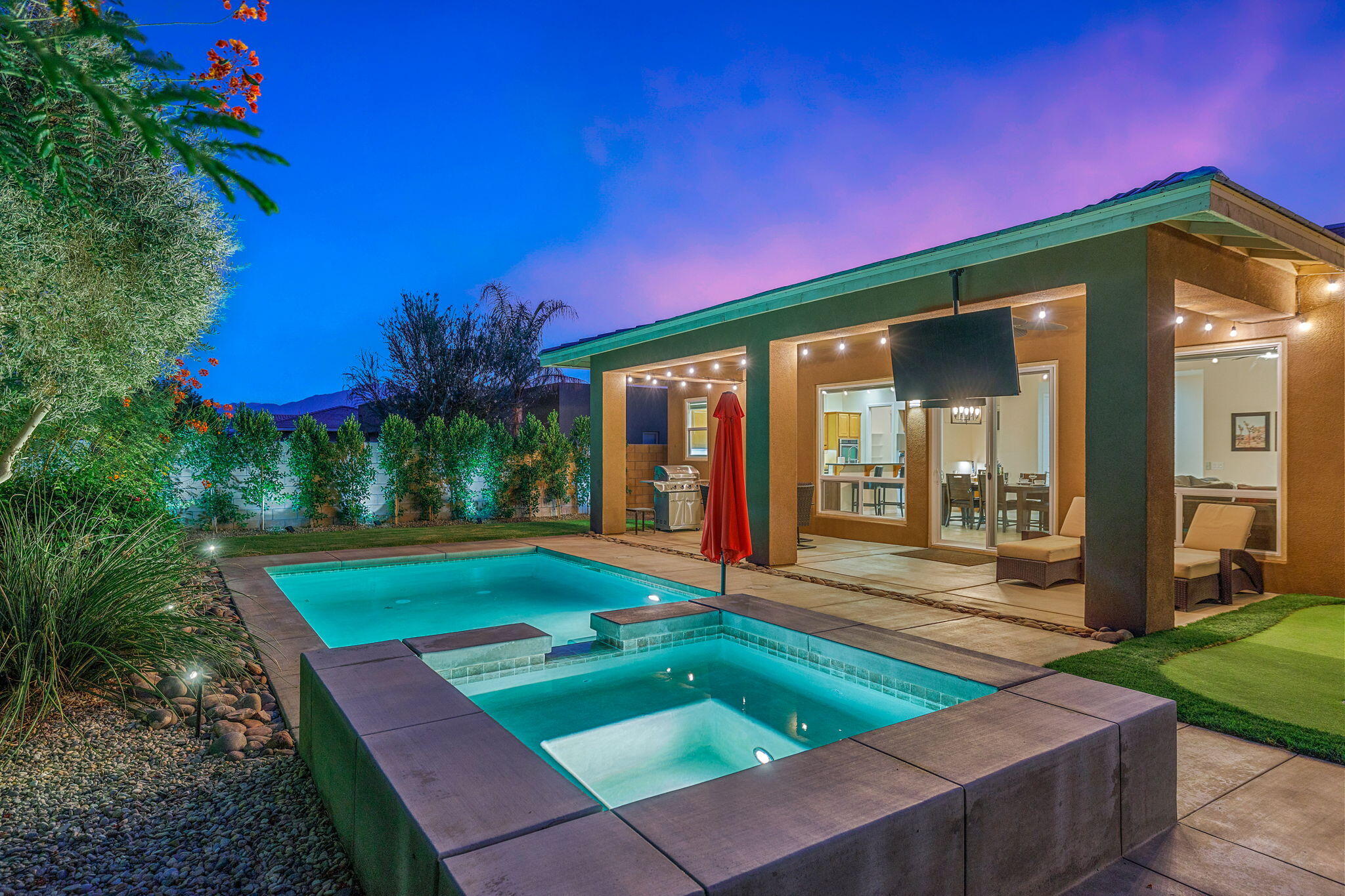 41252 Gaslight Avenue Bermuda Dunes, CA 92203 - Photo 1 of 37 a front view of house with yard and outdoor seating