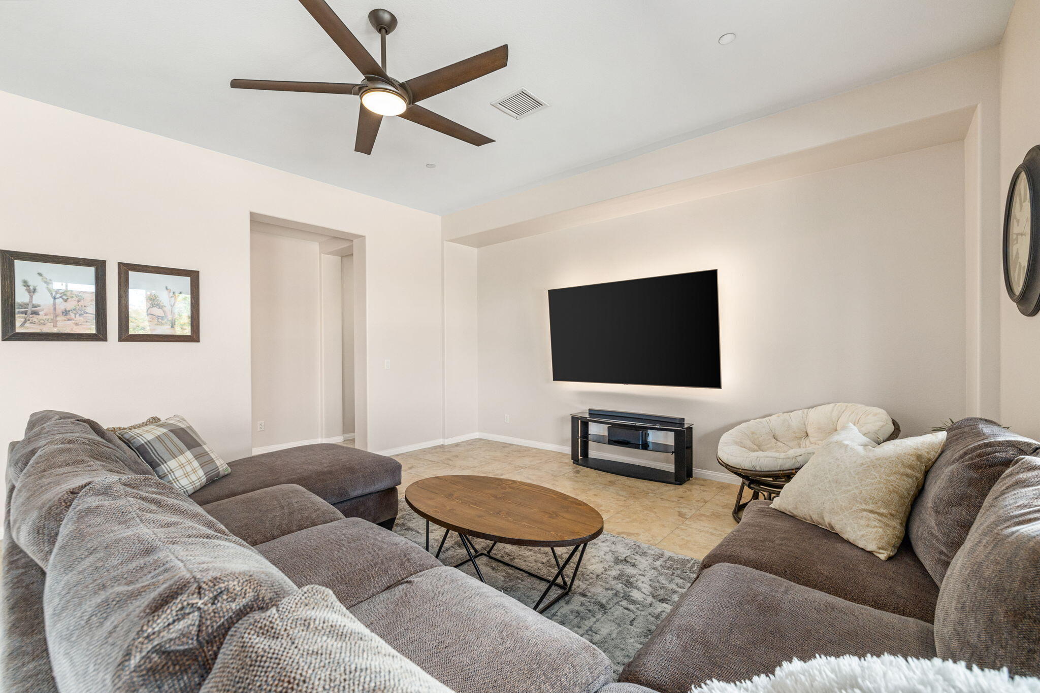 41252 Gaslight Avenue Bermuda Dunes, CA 92203 - Photo 12 of 37 a living room with furniture and a flat screen tv