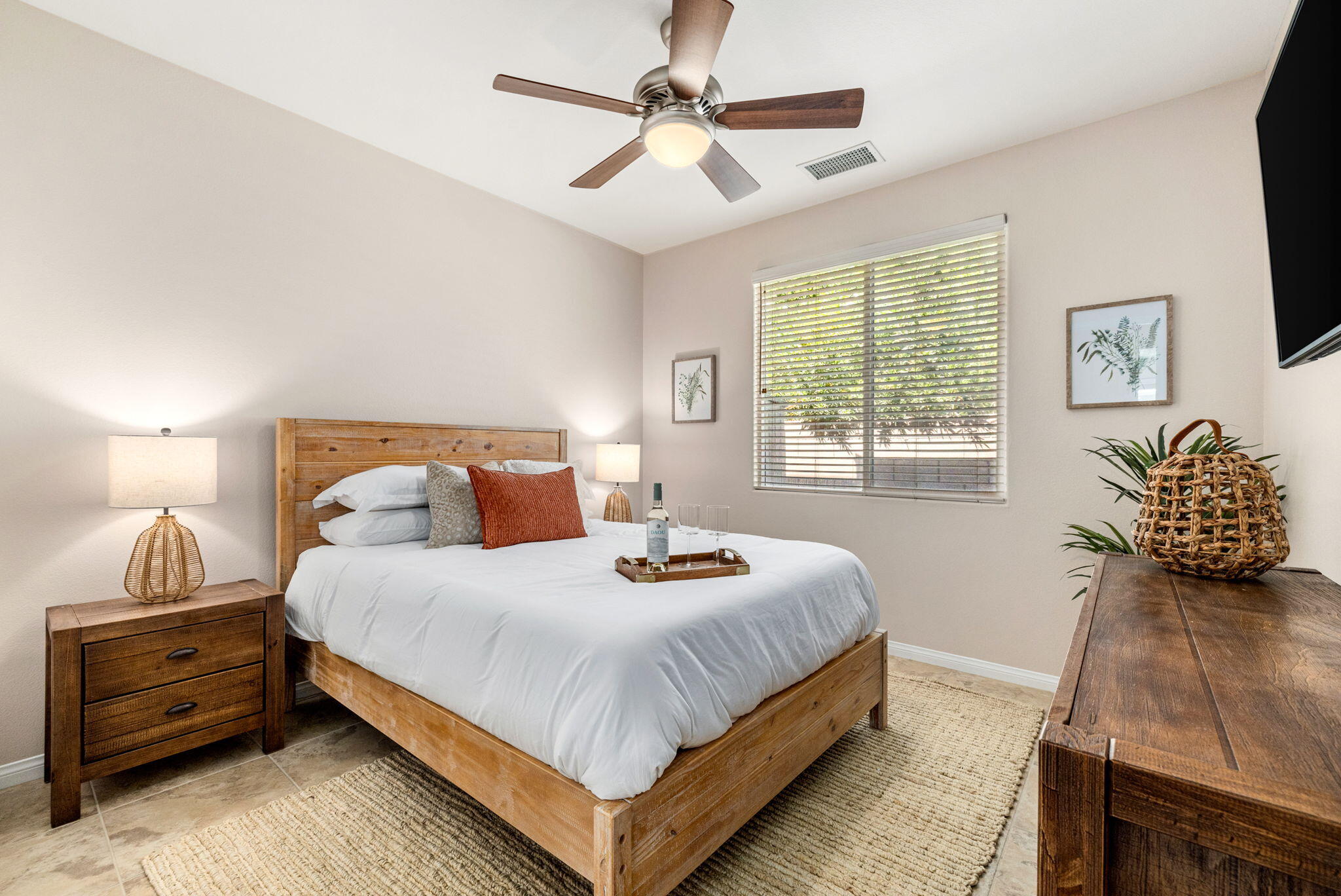 41252 Gaslight Avenue Bermuda Dunes, CA 92203 - Photo 20 of 37 a bedroom with a bed and a flat tv screen on dresser