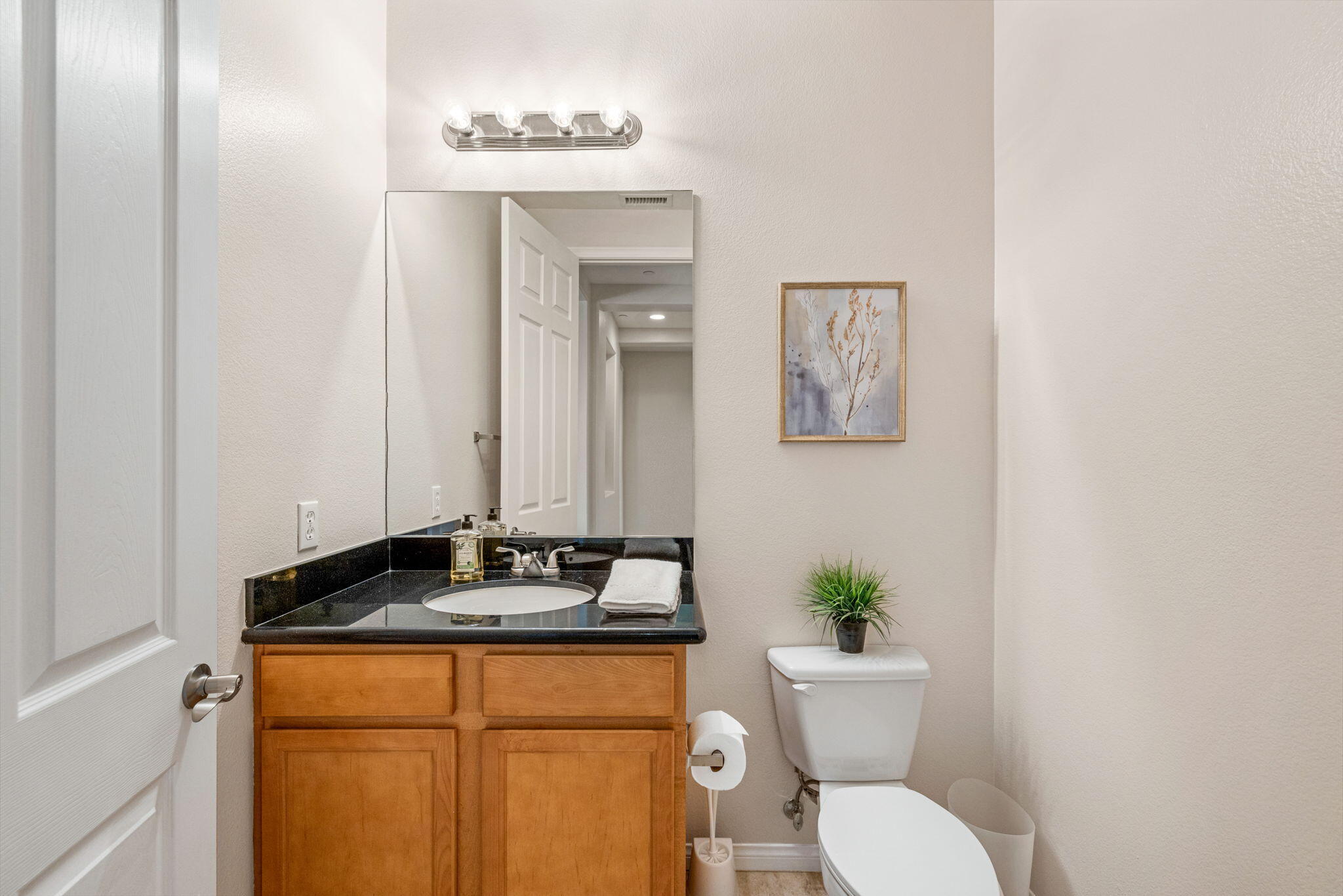 41252 Gaslight Avenue Bermuda Dunes, CA 92203 - Photo 24 of 37 a bathroom with a granite countertop sink and a toilet