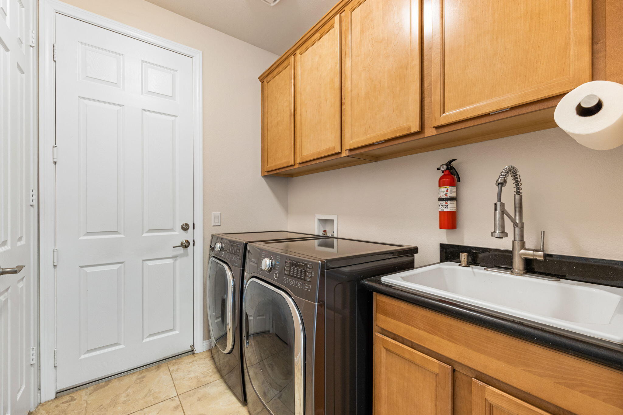 41252 Gaslight Avenue Bermuda Dunes, CA 92203 - Photo 25 of 37 a utility room with sink dryer and washer