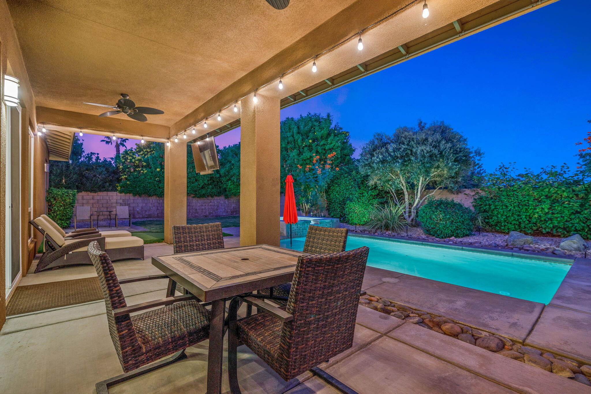 41252 Gaslight Avenue Bermuda Dunes, CA 92203 - Photo 33 of 37 a view of a patio with a table and chairs