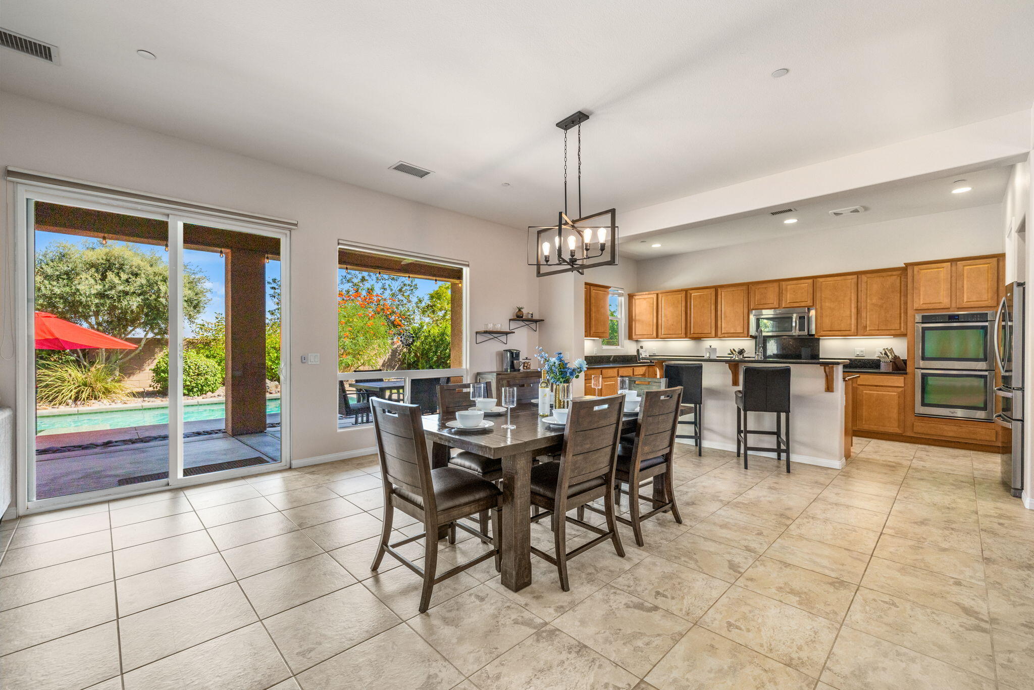 41252 Gaslight Avenue Bermuda Dunes, CA 92203 - Photo 4 of 37 a view of a dining room with furniture window and outside view