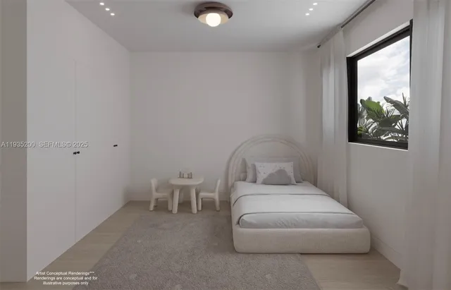 a bedroom with a bed and a painting on the wall