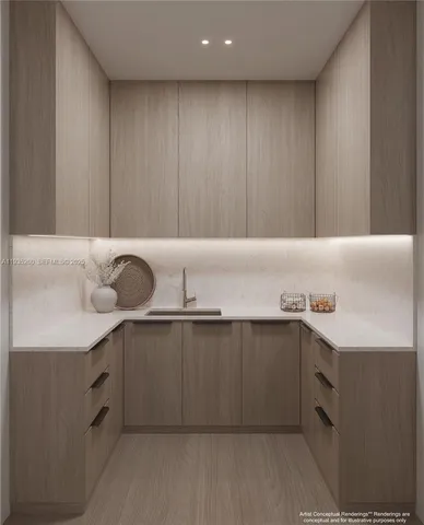 a kitchen with a sink and cabinets