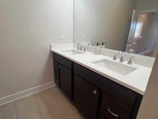 a bathroom with a sink double vanity and a mirror